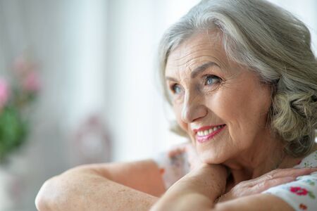 portrait of happy senior woman at home