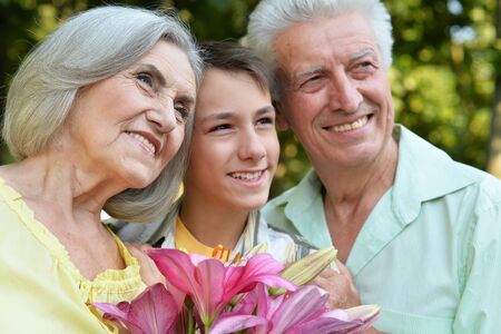 Close up portrait of happy grandfather, grandmother and grandson