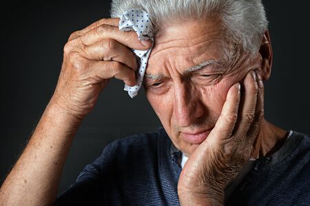 Close up portrait of sick senior man