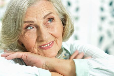 portrait of happy senior woman at home