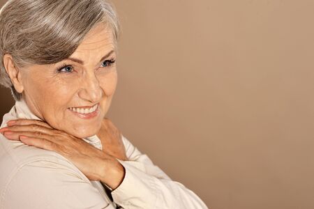 Close up portrait of beautiful smiling senior woman posing