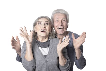 Portrait of happy senior couple on white backgroundの写真素材