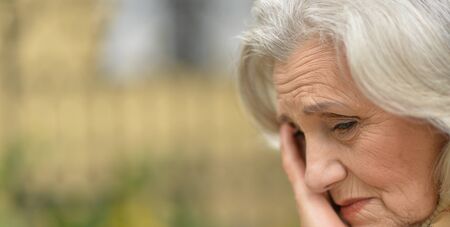 Close up portrait of sad senior womanの写真素材