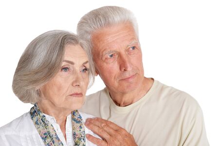 Portrait of sad senior couple isolated on white background