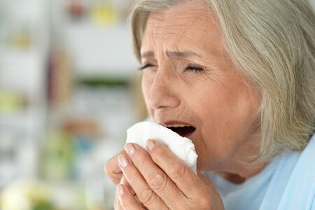 Close up portrait of sad ill senior woman