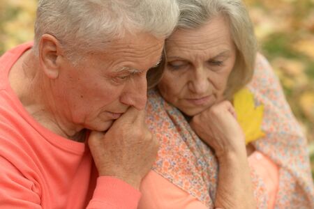 Portrait of unhappy senior couple in the parkの写真素材