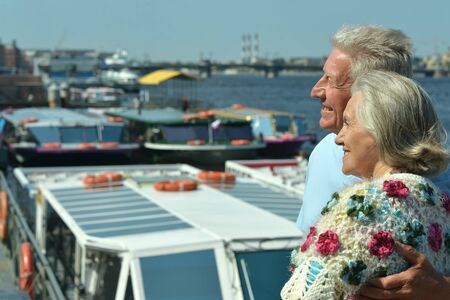 Portrait of happy elderly couple in portの写真素材