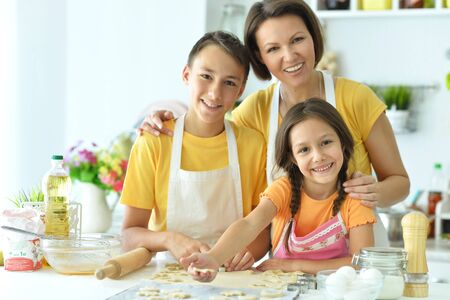 Happy family baking together in the kitchen