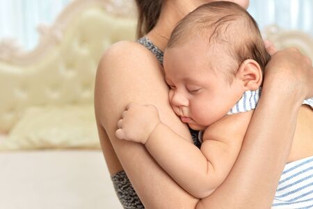 Portrait of mother with cute little baby girl