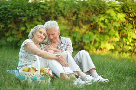 Portrait of loving elderly couple having a picnicの写真素材
