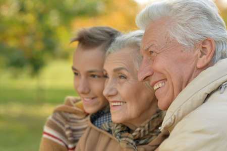 Close up portrait of happy grandfather, grandmother and grandson