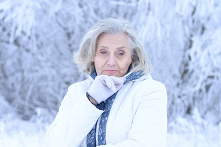 Close up portrait of sad beautiful senior womanの写真素材
