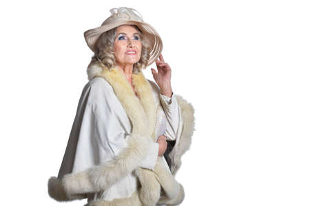Smiling gorgeous mature woman in white coat