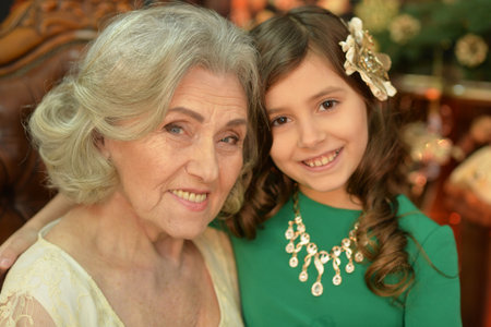Portrait of a smiling grandmother and her granddaughter