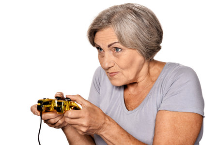 Close-up portrait of happy elderly woman holding joystick