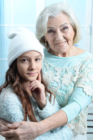 Portrait of a smiling grandmother and her granddaughterの写真素材