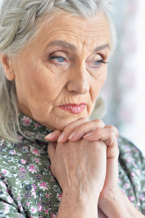 Close up portrait of sad senior womanの写真素材