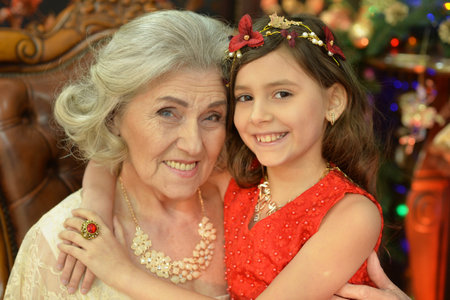 Portrait of a smiling grandmother and her granddaughterの写真素材