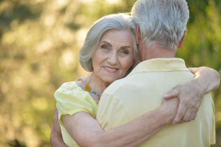 Portrait of beautiful caucasian senior couple huggingの写真素材