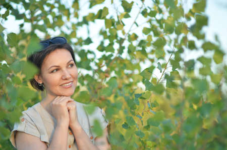 Portrait of a beautiful young woman in a park