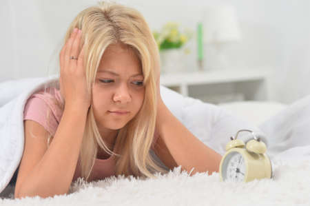 Cute little girl awaked up in her bed