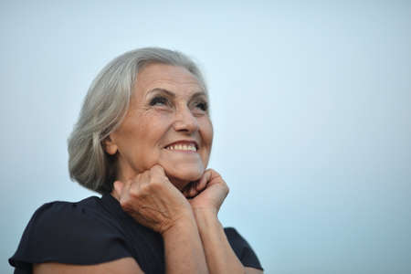 Portrait of a happy smiling senior woman outdoors