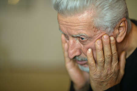 Portrait of a sad thinking senior man