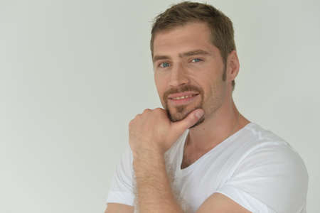 Portrait of handsome young man posing in studio
