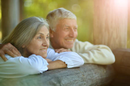 Portrait of happy senior couple posing outdoors