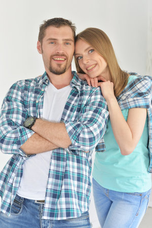 Portrait of happy young couple posing at homeの写真素材