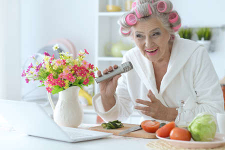 Portrait of senior woman in hair rollersの写真素材