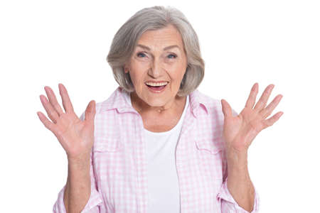 Close up portrait of beautiful senior woman posing isolated