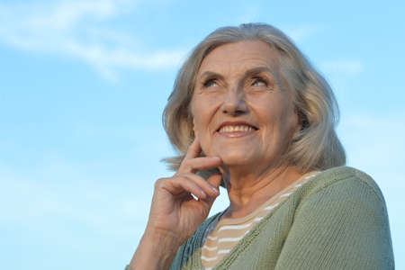 Portrait of happy smiling senior woman outdoorsの写真素材