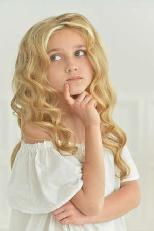 Portrait of beautiful girl looking away in studioの写真素材