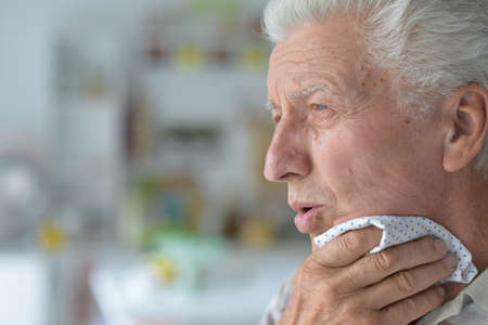 Portrait of sad sick senior manの写真素材