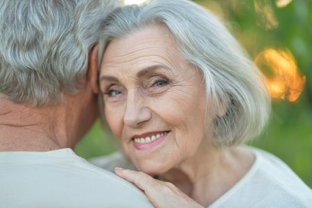 Portrait of beautiful caucasian senior couple hugging