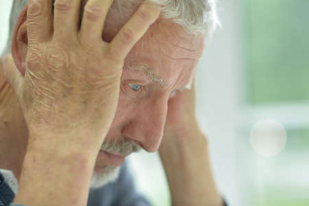 Portrait of sad thinking senior manの写真素材