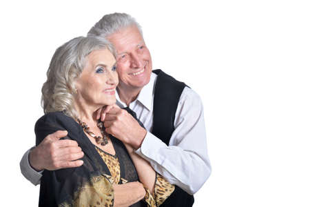 Close up portrait of happy senior couple hugging