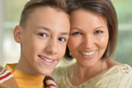 young mother and son smiling