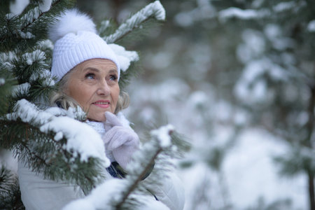 Nice old woman in a fur coat in the winterの写真素材