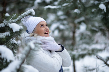 Nice old woman in a fur coat in the winter