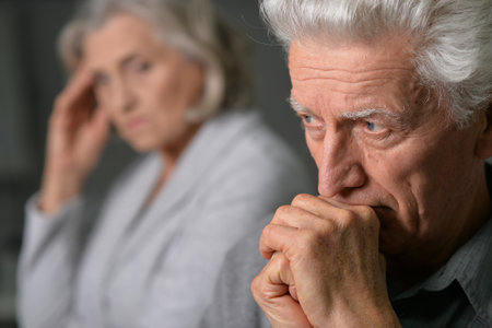 Portrait of sick elderly couple at homeの写真素材