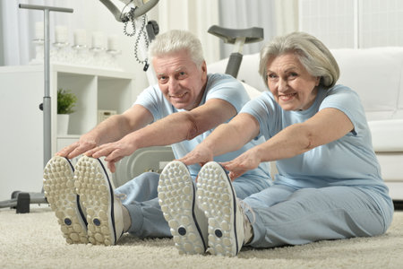 Portrait of happy sporty senior couple exercisingの写真素材