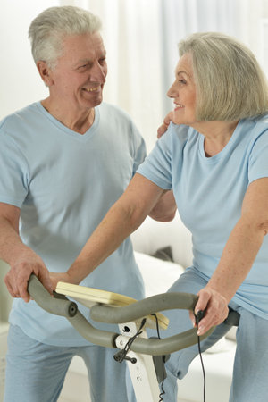 Portrait of happy sporty senior couple exercisingの写真素材