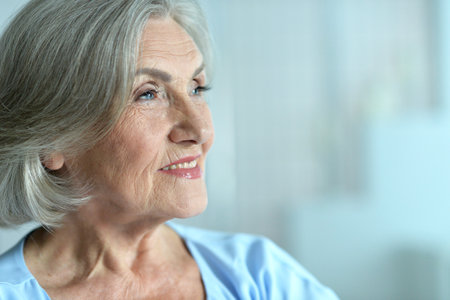 Portrait of happy beautiful senior woman posingの写真素材