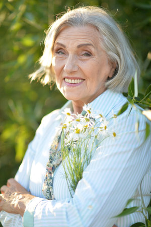 Portrait of a beautiful woman in the park in summerの写真素材
