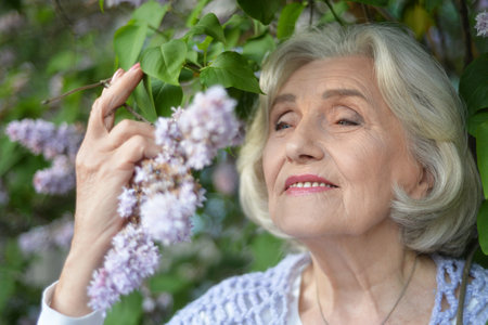 Portrait of a beautiful woman in the park in summerの写真素材