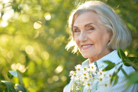 Portrait of a beautiful woman in the park in summerの写真素材