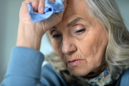Close up portrait of a sick senior womanの写真素材