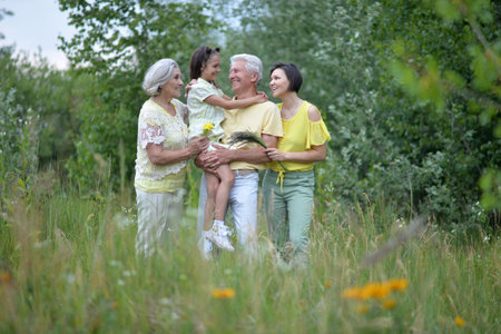 A happy family walks in the parkの写真素材